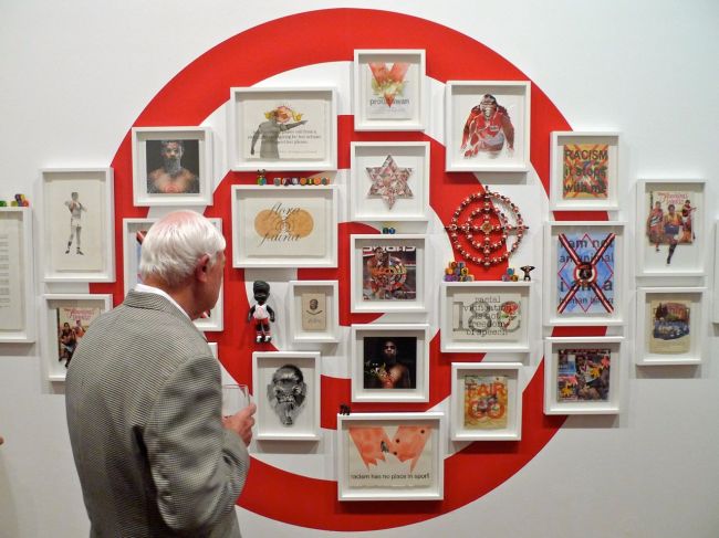 A punter checks out Tony Albert's winning work