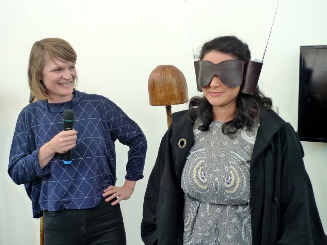 Caitlin blindfolds the Curator Kristi Monfries